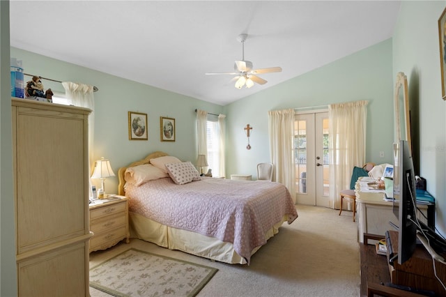 bedroom with a ceiling fan, access to outside, french doors, light colored carpet, and vaulted ceiling