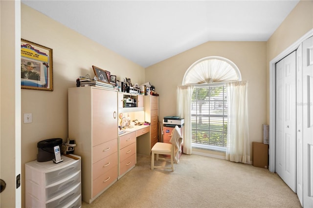 office space with light carpet and lofted ceiling