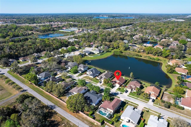 bird's eye view featuring a residential view and a water view