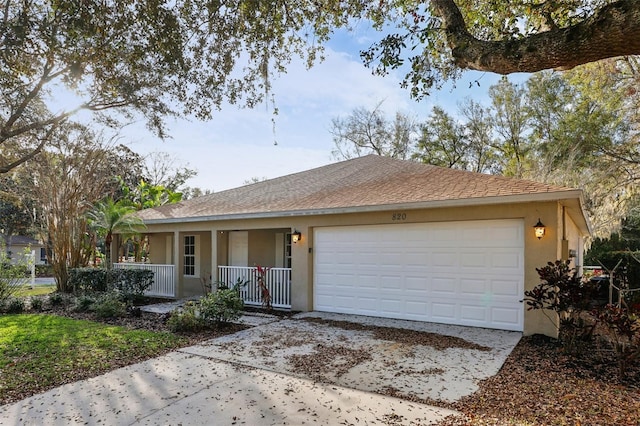 ranch-style home featuring covered porch and a garage