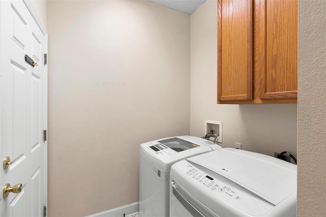 laundry room featuring cabinet space and washing machine and clothes dryer