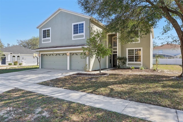 view of front of property with a front lawn and a garage