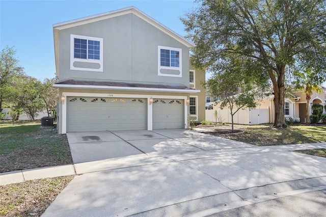 front facade with a garage and cooling unit