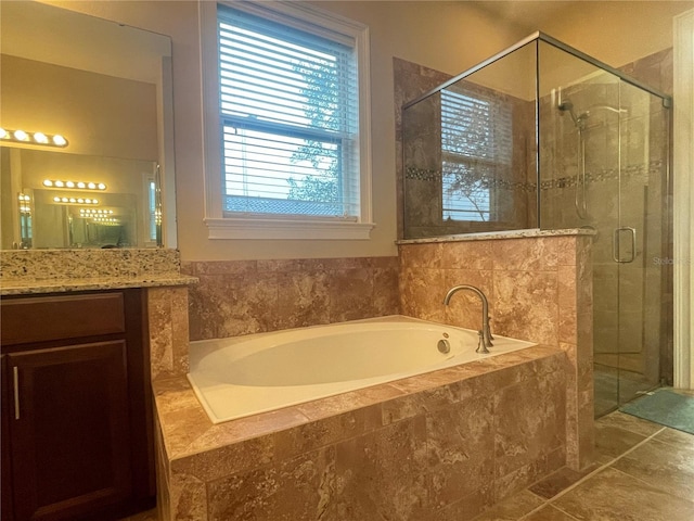 full bathroom with tile patterned flooring, a shower stall, vanity, and a bath