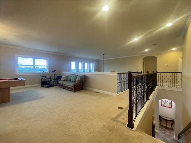 living area with ornamental molding, carpet, baseboards, and recessed lighting