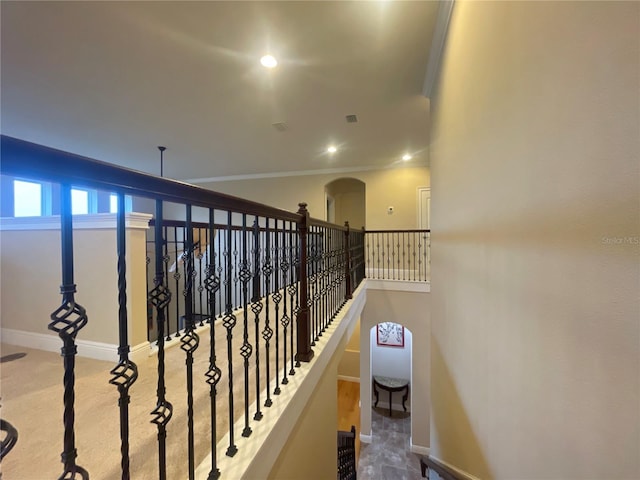 corridor with recessed lighting, visible vents, baseboards, and ornamental molding