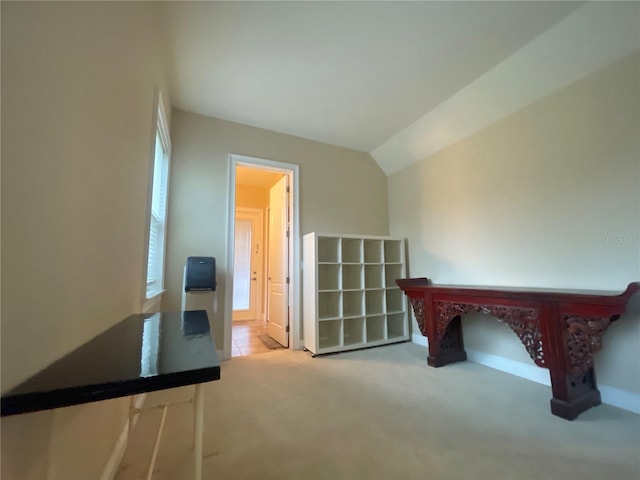 bonus room with carpet and vaulted ceiling