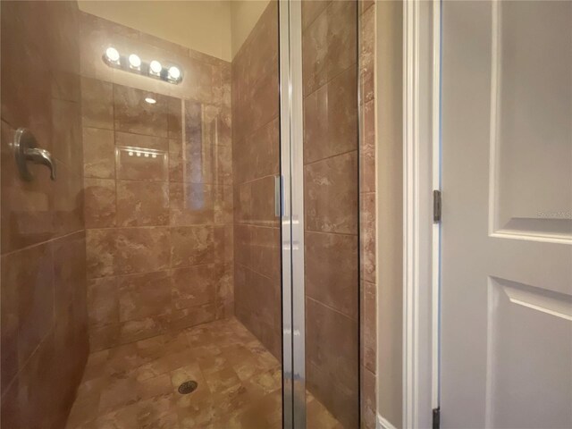 bathroom featuring a shower stall