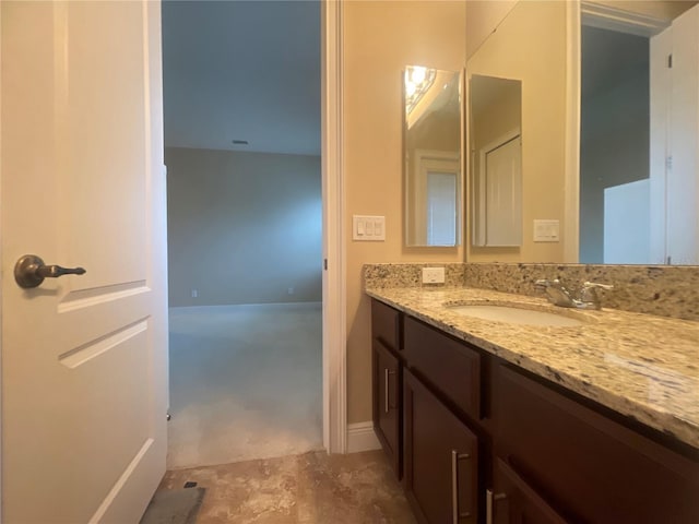 bathroom featuring concrete floors and vanity