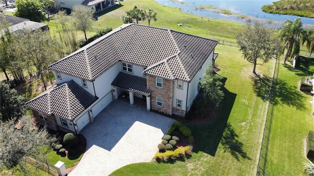 birds eye view of property featuring a water view