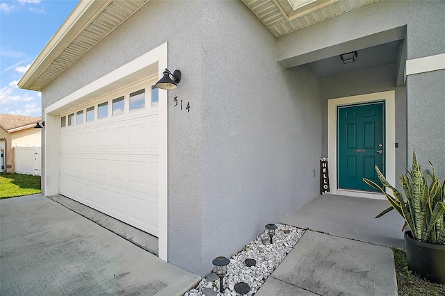 property entrance with a garage