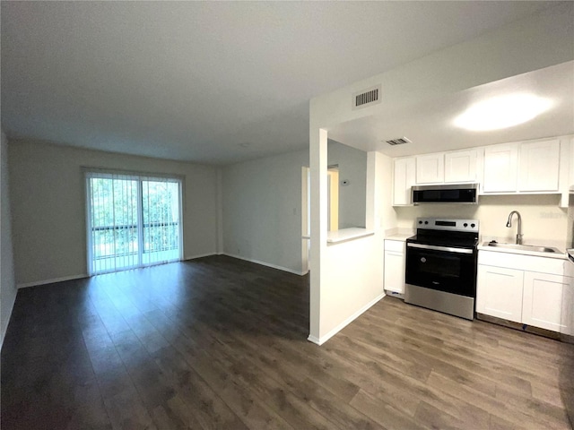 kitchen featuring stainless steel appliances, dark hardwood / wood-style flooring, sink, and white cabinets