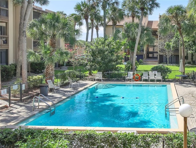 view of pool featuring a patio