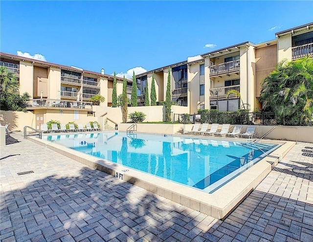 view of swimming pool with a patio area