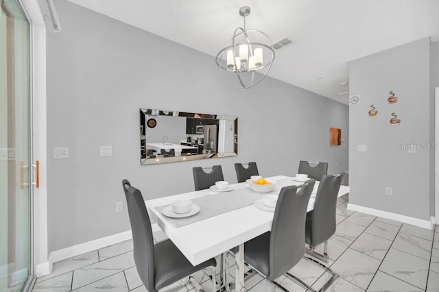 dining room featuring a chandelier, marble finish floor, visible vents, and baseboards