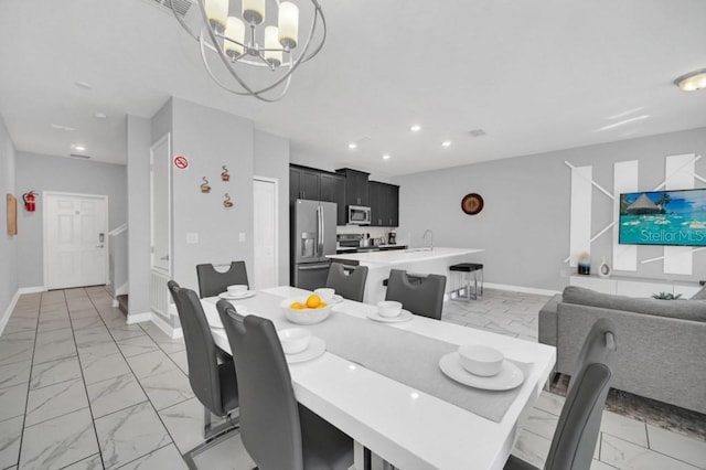 dining area featuring recessed lighting, marble finish floor, baseboards, and an inviting chandelier