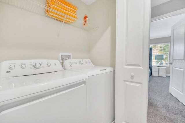 laundry room featuring laundry area, carpet, and washing machine and clothes dryer