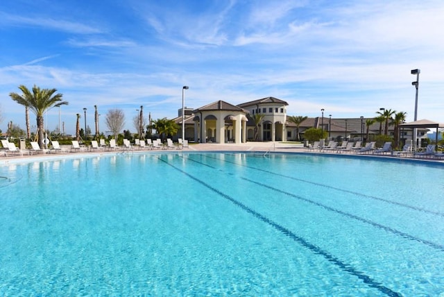 community pool with a patio area