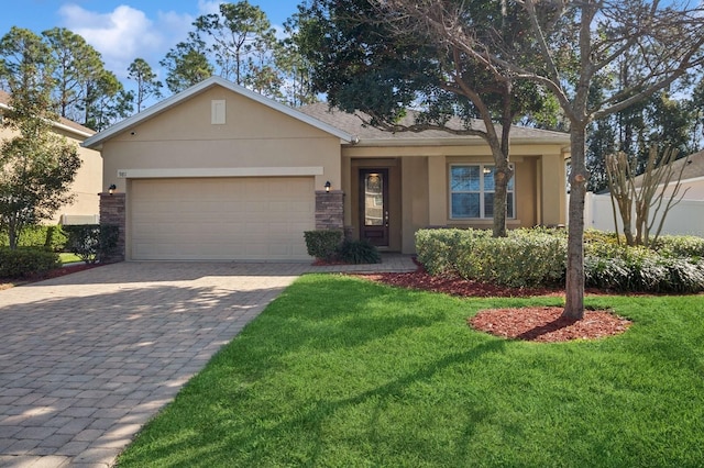 ranch-style house featuring a garage and a front lawn