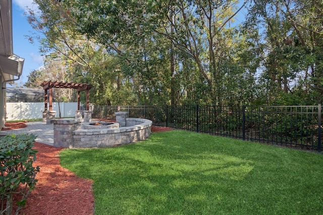 view of yard featuring a pergola, a patio area, and an outdoor fire pit