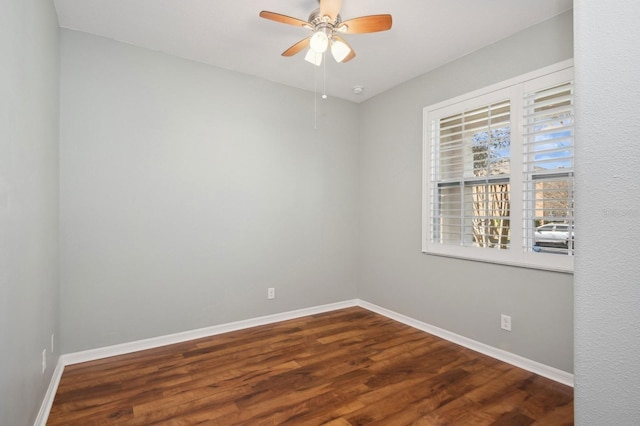 spare room featuring wood-type flooring and ceiling fan