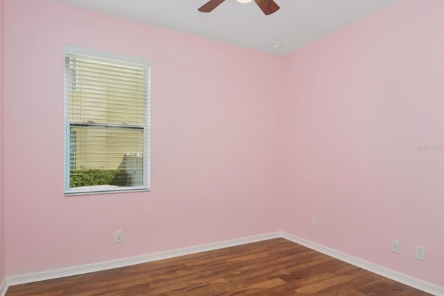 spare room featuring ceiling fan and hardwood / wood-style floors