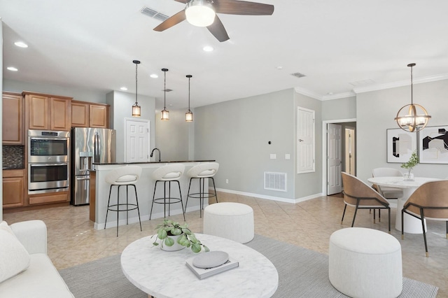981 Galway Blvd, Apopka, FL 32703 - living room with visible vents, recessed lighting, and ceiling fan with notable chandelier