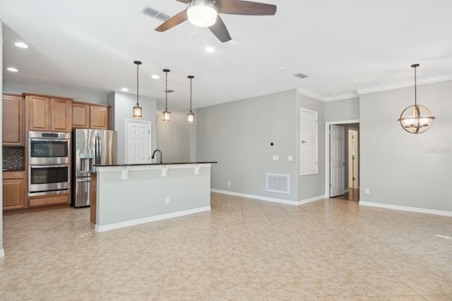 981 Galway Blvd, Apopka, FL 32703 - kitchen with ceiling fan with notable chandelier, visible vents, dark countertops, and appliances with stainless steel finishes