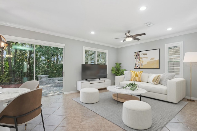 981 Galway Blvd, Apopka, FL 32703 - living room with light tile patterned flooring, visible vents, crown molding, recessed lighting, and ceiling fan with notable chandelier