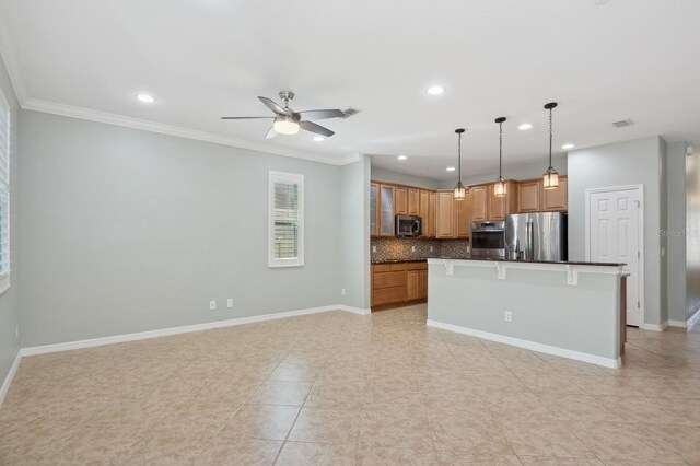 981 Galway Blvd, Apopka, FL 32703 - kitchen with tasteful backsplash, baseboards, dark countertops, a ceiling fan, and appliances with stainless steel finishes