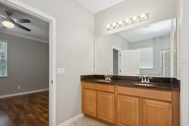 981 Galway Blvd, Apopka, FL 32703 - bathroom with double vanity, a sink, baseboards, and a shower stall