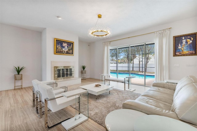 living room with a fireplace and light hardwood / wood-style floors