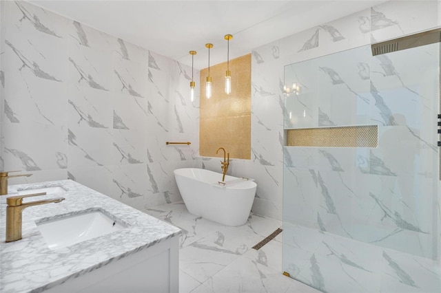 bathroom with vanity, shower with separate bathtub, and tile walls