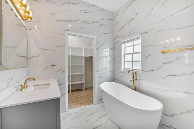 bathroom with vanity and a bathing tub