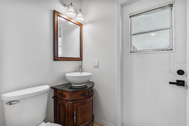 bathroom featuring vanity and toilet