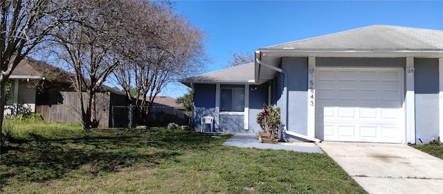 single story home featuring a shingled roof, fence, a front yard, stucco siding, and an attached garage