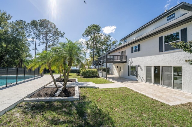 view of yard featuring a fenced in pool and a patio area