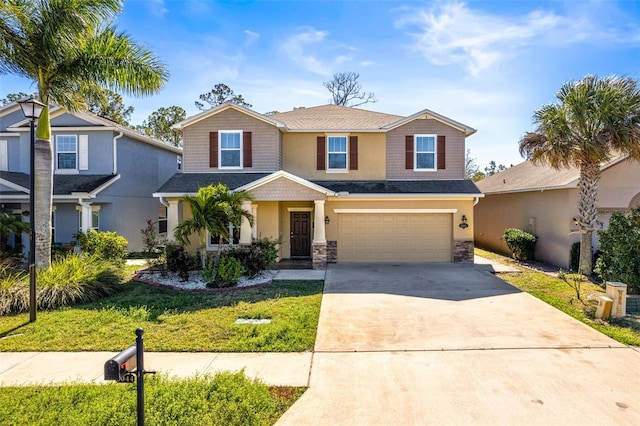 view of front of property with a garage, concrete driveway, stone siding, a front lawn, and stucco siding