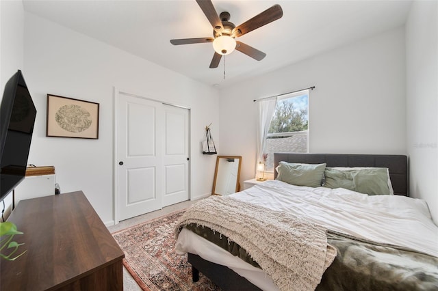 bedroom featuring a ceiling fan and baseboards