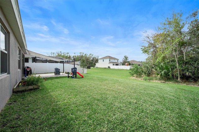 view of yard with a fenced backyard and a patio