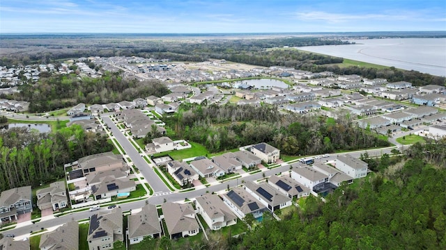 bird's eye view with a residential view and a water view