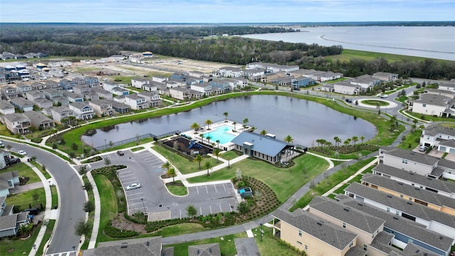 bird's eye view featuring a residential view and a water view