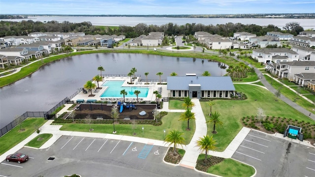 aerial view featuring a residential view and a water view