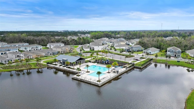 bird's eye view with a water view and a residential view