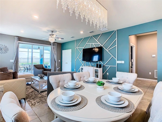 dining room featuring light tile patterned floors and ceiling fan