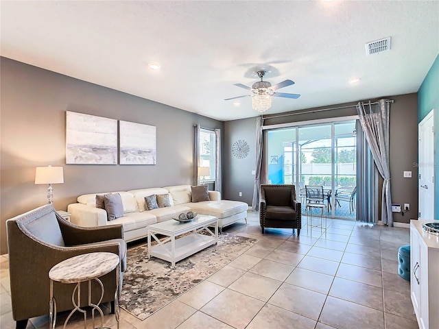 tiled living room featuring ceiling fan