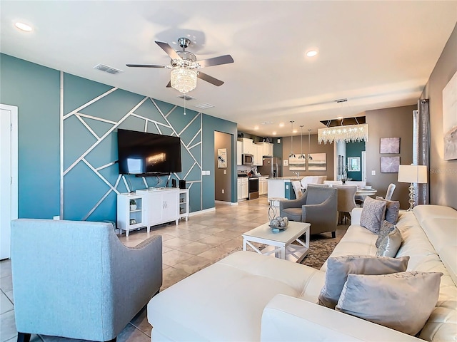 living room with tile patterned floors and ceiling fan