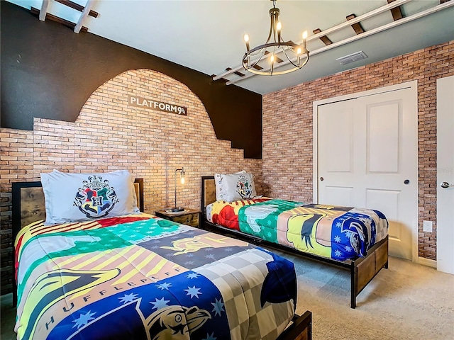 bedroom with carpet flooring, an inviting chandelier, and brick wall