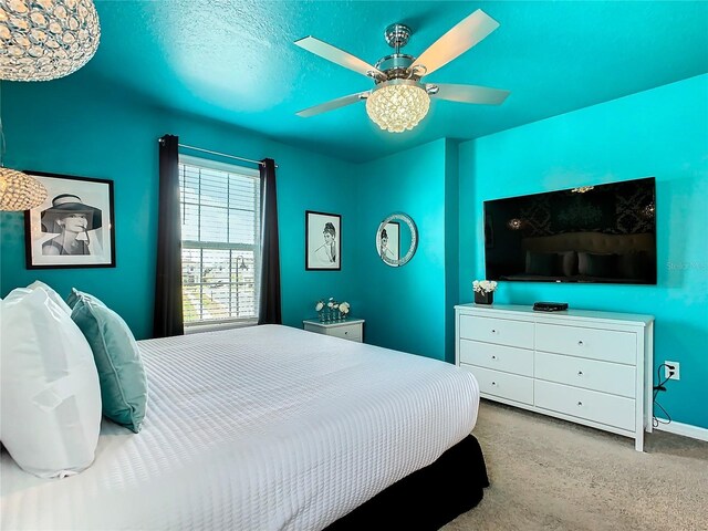 carpeted bedroom featuring ceiling fan