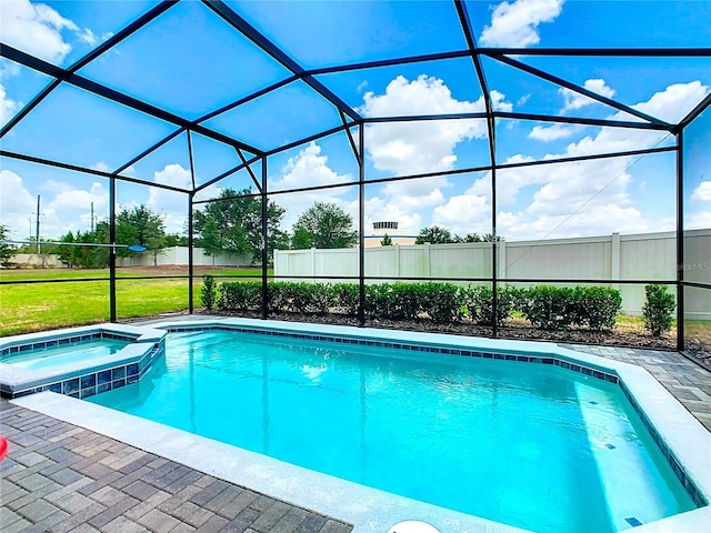 view of swimming pool featuring a lanai, a patio, and an in ground hot tub